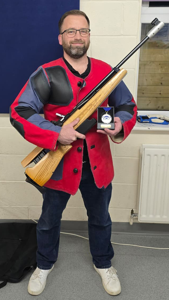 Photograph shows Dave Greaves of Lichfield Rifle and Pistol Club, proudly displaying his SSRA Individual 10 Metres Air Rifle 'B' League Winter 2025/2026 1st place medal.