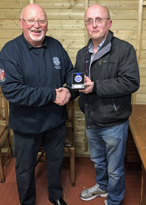 Photograph shows City of Stoke Chairman, Mike Baxter (pictured left), presenting Les Tolley (pictured right) with his SSRA Individual Air Pistol 'B' League - 1st Place Medal.