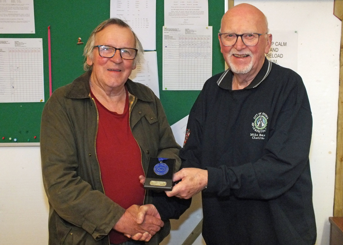 Photograph shows Mike Baxter, City of Stoke RPC Chairman (pictured right) presenting Ian Abbotts of City of Stoke RPC (pictured left)  with his SSRA Individual 10 Metres Air Rifle 'B' League 2nd Place Medal.