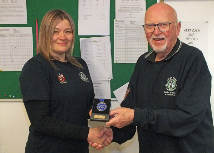 Photograph shows Mike Baxter, City of Stoke RPC Chairman (pictured right) presenting Steph Reynolds of City of Stoke RPC (pictured left)  with her SSRA Individual 10 Metres Air Rifle 'A' League 1st Place Medal.