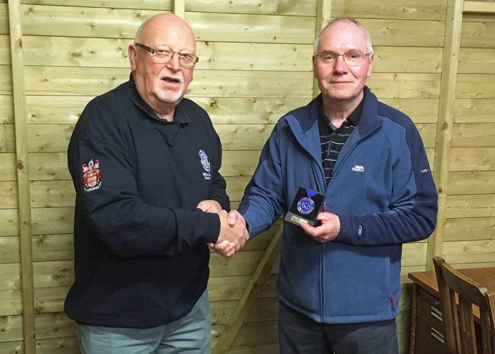 Photograph shows City of Stoke RPC Chairman - Mike Baxter (pictured left) presenting Peter Bryan (pictured right) with his SSRA Air Pistol Individual League 2nd Place Medal.