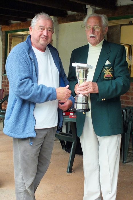 Photograph shows J. Wilshaw (pictured left) receiving the Moat Cup from SSRA President, Major (Retired) Peter Martin, MBE (pictured right).
