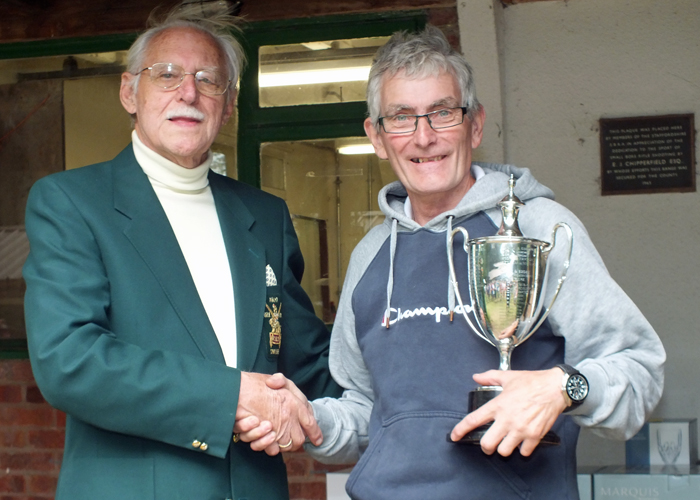 Photograph shows SSRA President - Major (Retired) Peter Martin MBE, pictured left - presenting the Michelin Cup to B. Tonks, pictured right.