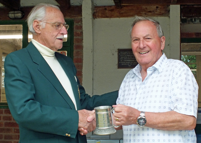 Photograph shows SSRA President - Major (Retired) Peter Martin MBE, pictured left - presenting the Astor Tankard to M.B.P. Willcox - representing City of Birmingham R.C., right.