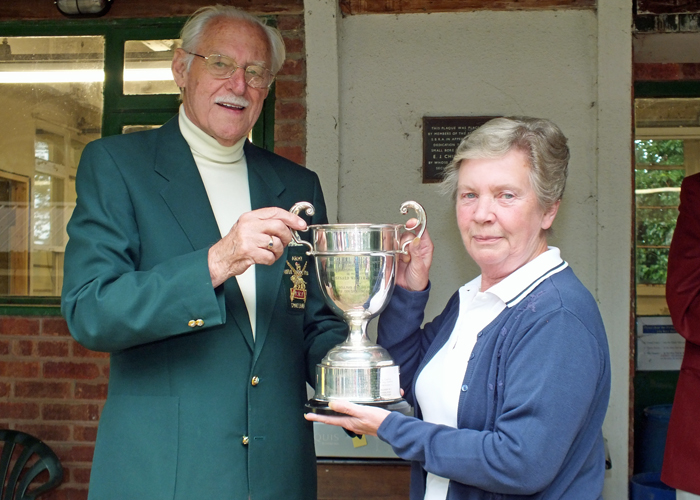 Photograph shows SSRA President - Major (Retired) Peter Martin MBE, pictured left - presenting the R.W. De Nicolas Memorial Trophy to Mrs. M. Bayley, pictured right.