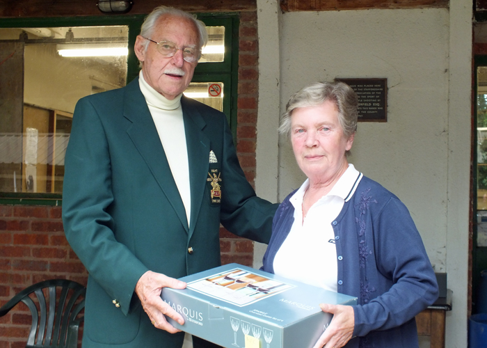 Photograph shows Mrs. M. Bayley (pictured right) receiving the Class 'C' First Place Prize from SSRA President, Major (Retired) Peter Martin, MBE (pictured left)