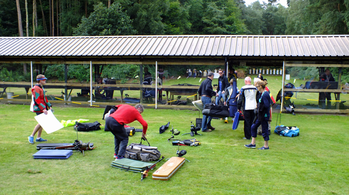 Photograph shows competitors busily gathering up their equipment at a detail change over.