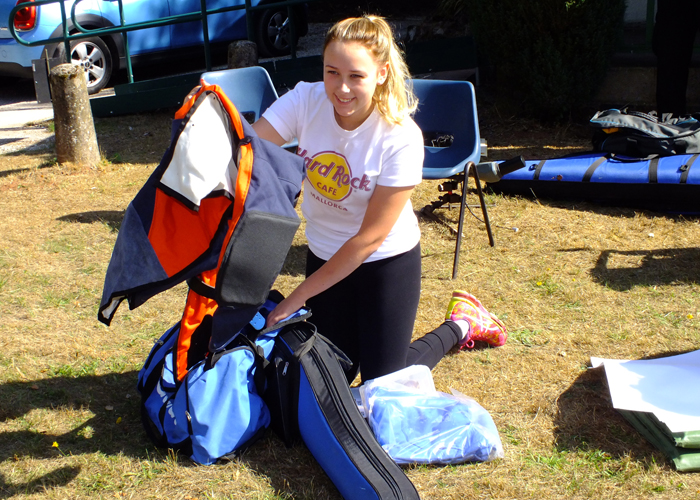 Photograph shows a junior member of the West Midlands Regional Target Shooting Squad in the throws of sorting out her kit.