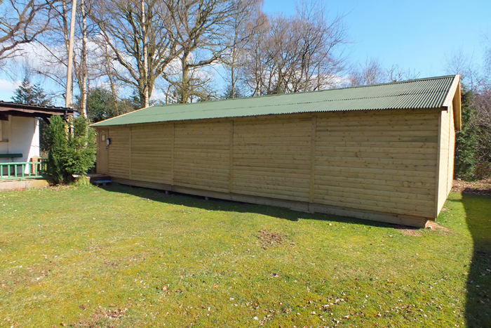 Picture shows a wooden building.  Any ideas as to what it can be?  All will be revealed very soon.