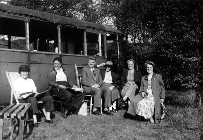 Photograph shows the dilapidated bus that was used as a temporary clubhouse-come-shelter, prior to the erection of a purpose-built clubhouse.