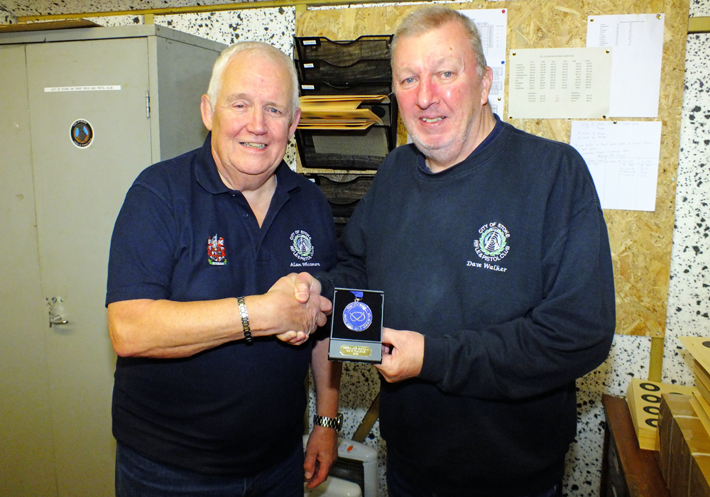 Photograph shows Dave Walker of City of Stoke Rifle and Pistol Club (pictured right) receiving his SSRA Individual 10 Metres Air Rifle - 'A' League - Summer 2026 - 2nd Place Medal from Alan Whitmore of City of Stoke Rifle and Pistol Club (pictured left).
