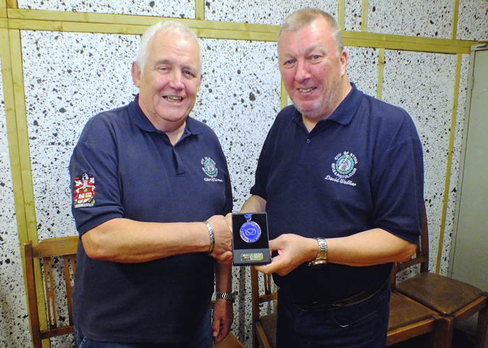 Photograph shows Alan Whitmore of City of Stoke RPC (pictured left) receiving his SSRA Individual Air Rifle "B" League - 2nd Place Medal from David Walker of City of Stoke RPC (pictured right).