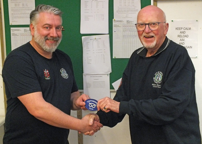 Photograph shows Mike Baxter, City of Stoke RPC Chairman (pictured right) presenting the Staffordshire Inter-County Team Badge to Staffordshire 10 Metres Air Pistol Team Member Mike Reynolds (pictured left) for completing his first full season representing Staffordshire at Inter-County level.