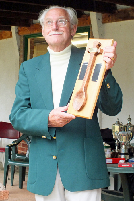 Photograph shows SSRA President - Major (Retired) Peter Martin, MBE., announcing I. Leigh as being the latest recipient of The Wooden Spoon.