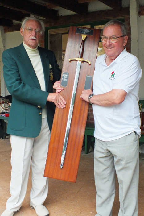 Photograph shows M.B.P. Willcox, pictured right, receiving The Association Cup from SSRA President - Major (Retired) Peter Martin, MBE.