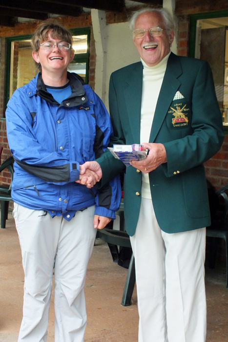 Photograph shows Ms L. Asquith (pictured left) receiving the Staffordshire Open 'Top Lady' Prize from SSRA President, Major (Retired) Peter Martin, MBE (pictured right).