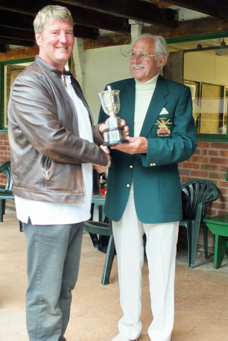 Photograph shows N. Almond, pictured left, receiving The Association Cup from SSRA President - Major (Retired) Peter Martin, MBE.