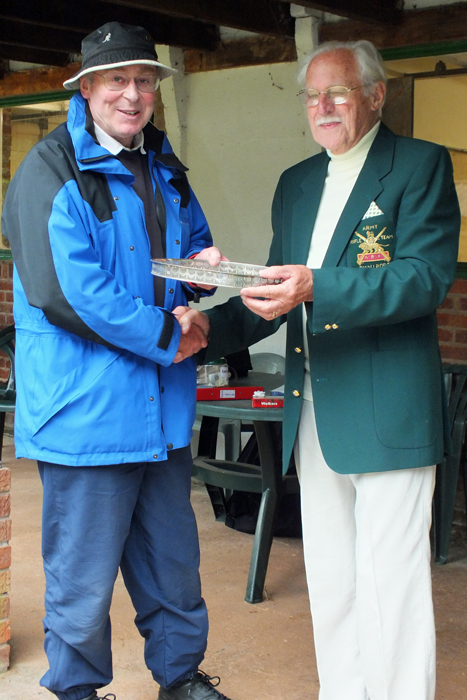 Photograph shows N. Peters (pictured left) receiving the 'Come Day - Go Day' Salver from SSRA President, Major (Retired) Peter Martin, MBE (pictured right).