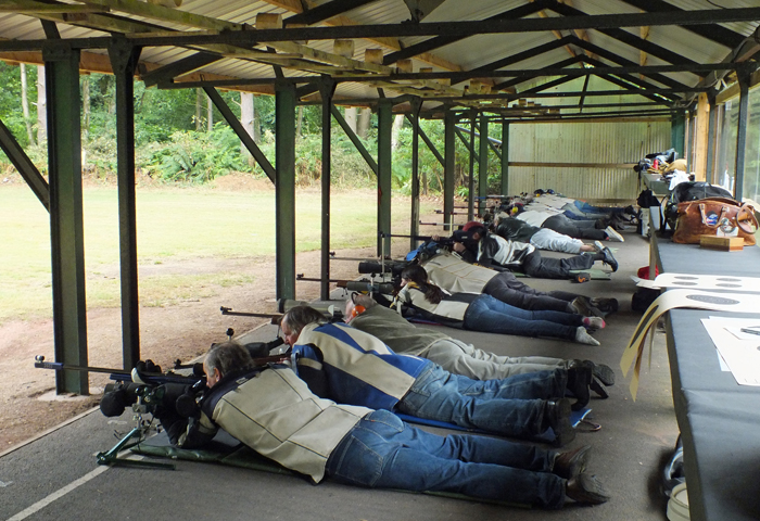 Photograph shows competitors in full concentration as their detail commences.