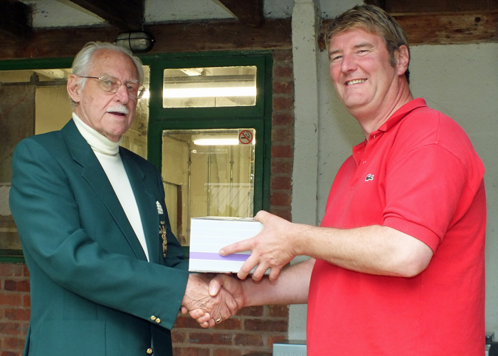 Photograph shows N. Almond (pictured right) receiving the Class 'A' Second Place Prize from SSRA President, Major (Retired) Peter Martin, MBE (pictured left)