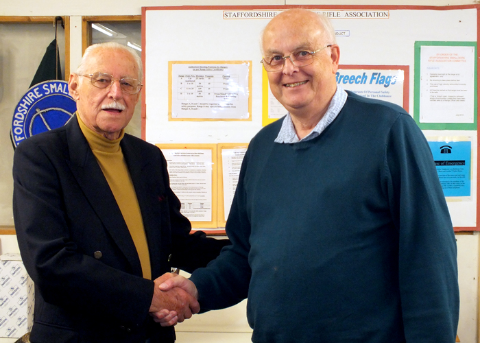 Photograph shows SSRA President - Major (Retired) Peter Martin MBE, pictured left - congratulating Tom Glover, pictured right, who gratefully received the Association Shield on behalf of Rugeley Rifle Club.