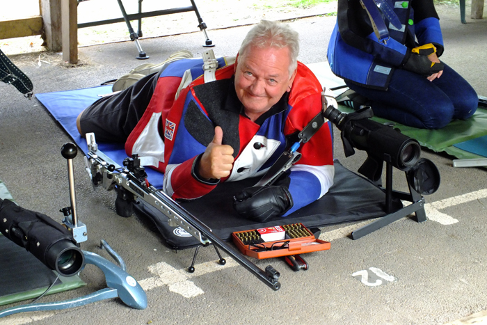 Photograph shows that all is well with one competitor, and very enjoyable on the firing line too, by giving a huge smile and a big thumbs up.