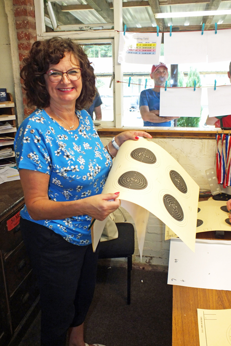 Photograph shows Judith Simcock diligently processing the shot targets.