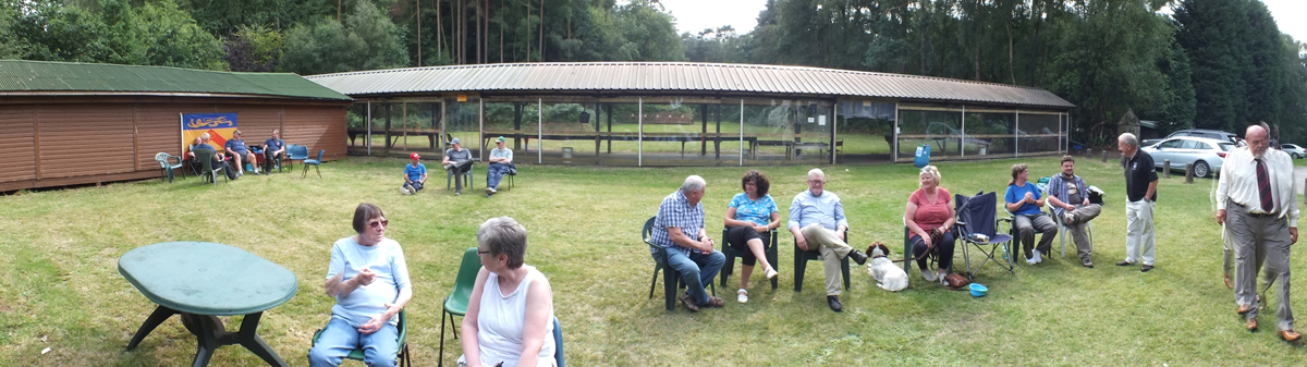 Photograph gives a panoramic view of the range, as competitors and officials alike take a well earned rest, prior to the awards ceremony.