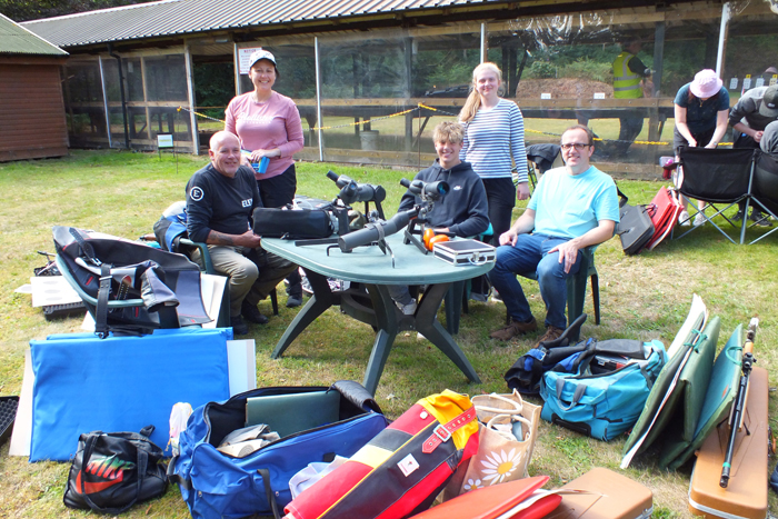 Photograph shows a fine group of shooters - cool, calm and collected - at least for now.