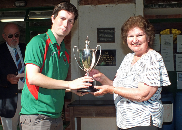 Photograph shows Mrs. Janet Troke (pictured right), presenting the Michelin Cup to Richard Hemingway (pictured left).