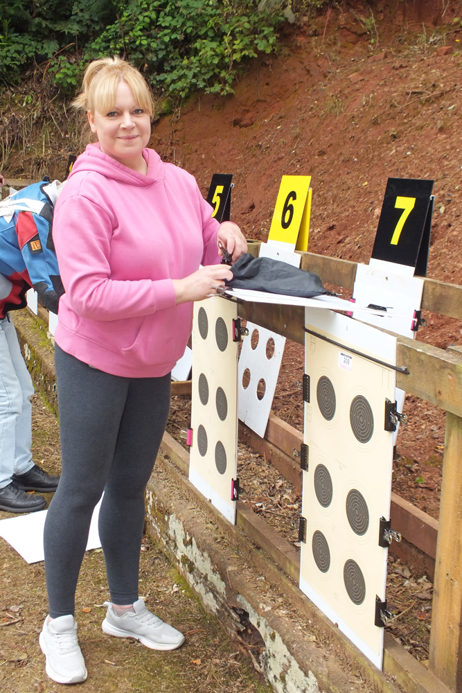Photograph shows a competitor taking a more relaxed approach to ensuring the correct replacement of targets ... a really peaceful image.