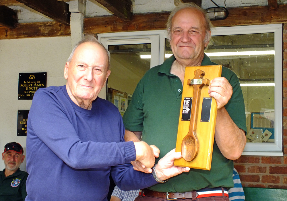 Photograph shows SSRA President - Mike B.P. Willcox (pictured left), presenting the Wooden Spoon for 2026 to Bob Heath (pictured right).