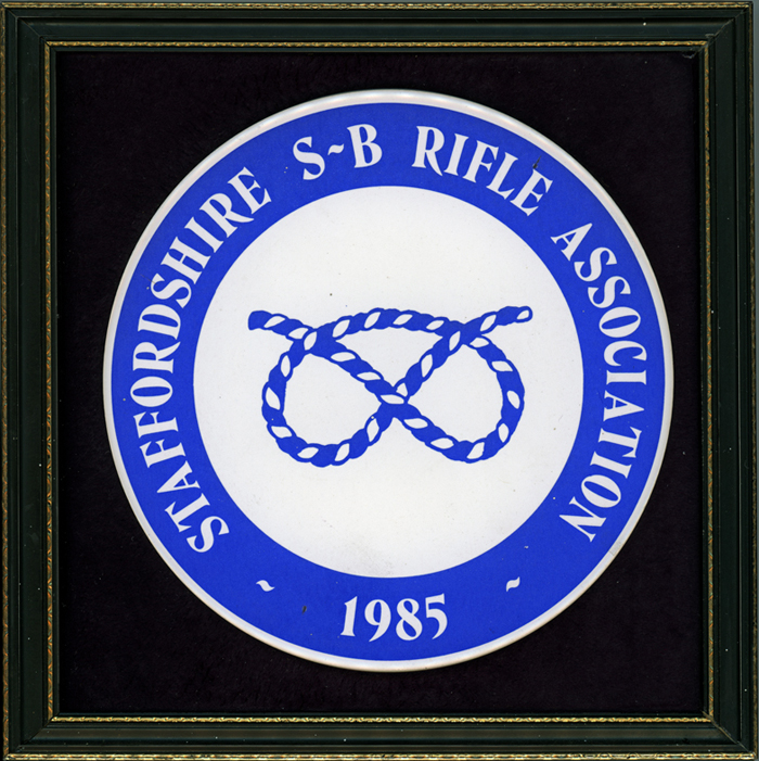 Photograph shows the ceramic plaque which was presented in 1985 by Staffordshire Smallbore Rifle Association to Major (Retired) Peter Martin, MBE.